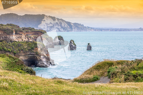 Image of sea shore rocks and mount Taranaki, New Zealand