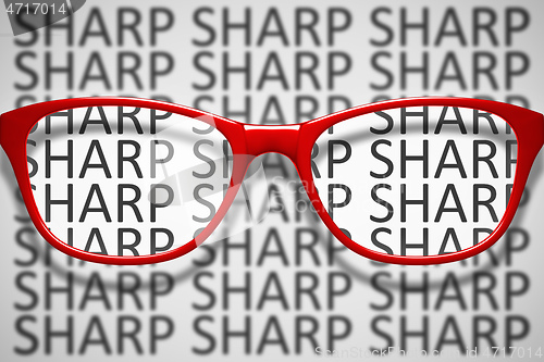 Image of red glasses with text sharp and blurred