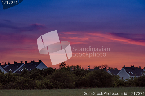 Image of Houses and trees at sunset