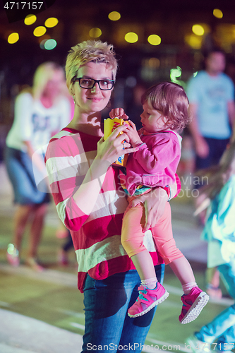 Image of mother and little daughter in the kids disco