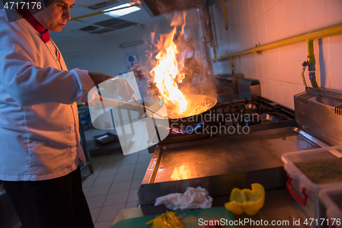 Image of Chef doing flambe on food