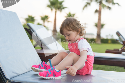 Image of little cute girl enjoying summer vacations