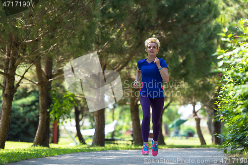 Image of young female runner training for marathon