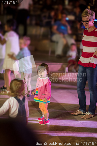 Image of little girl dancing in the kids disco