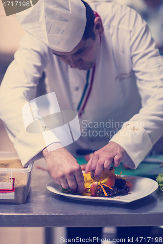 Image of chef serving vegetable salad