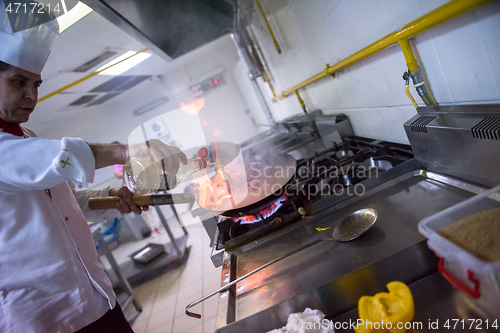 Image of Chef doing flambe on food