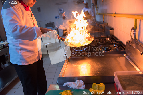 Image of Chef doing flambe on food