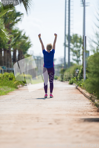 Image of young female runner training for marathon