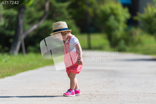 Image of little girl runing in the summer Park