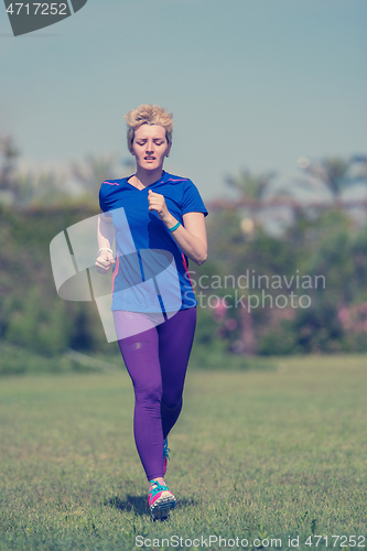 Image of young female runner training for marathon