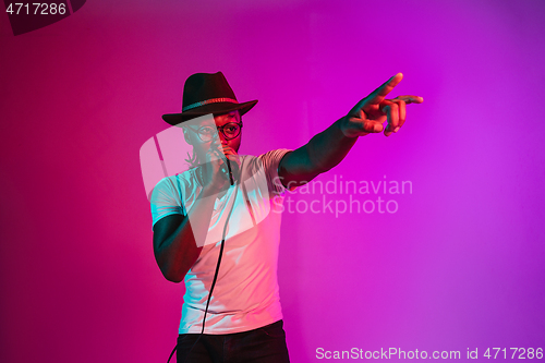 Image of Young african-american jazz musician singing a song