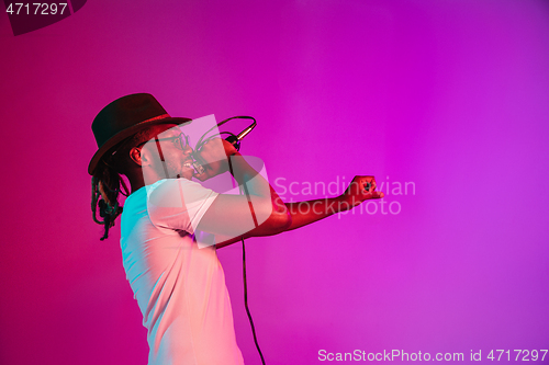 Image of Young african-american jazz musician singing a song