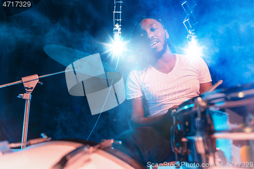 Image of Young african-american jazz musician playing drums