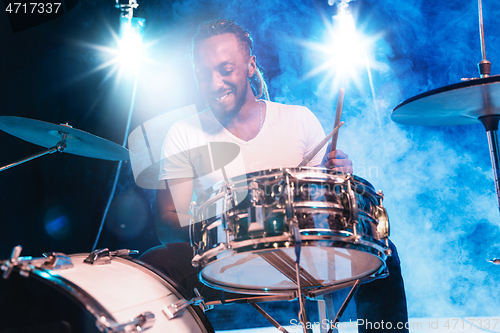 Image of Young african-american jazz musician playing drums