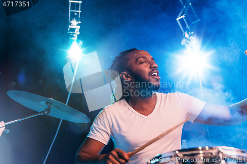 Image of Young african-american jazz musician playing drums