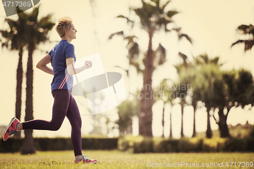 Image of young female runner training for marathon