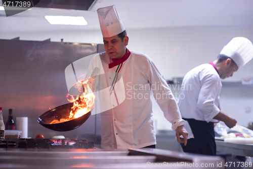 Image of Chef doing flambe on food