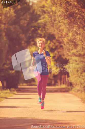 Image of young female runner training for marathon