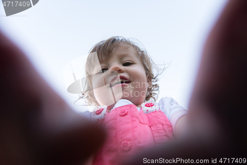 Image of little girl spending time at backyard