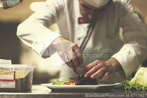 Image of chef serving vegetable salad