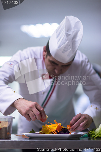 Image of chef serving vegetable salad