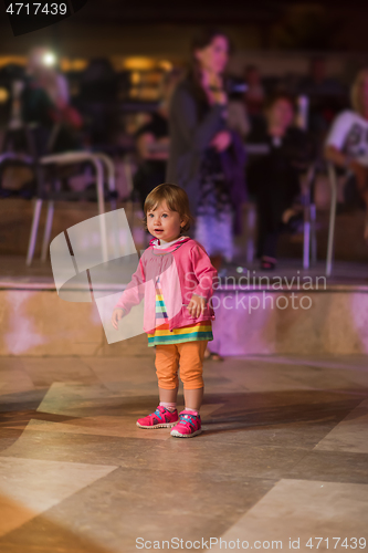 Image of little girl dancing in the kids disco