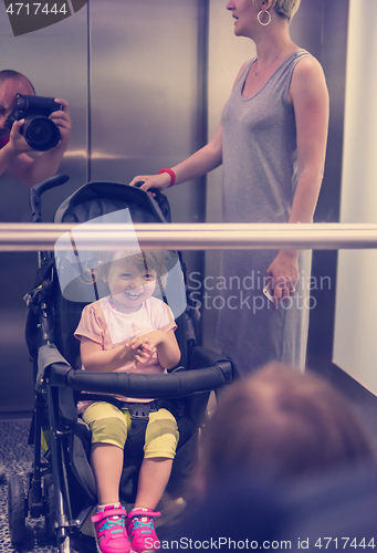 Image of happy family in the elevator