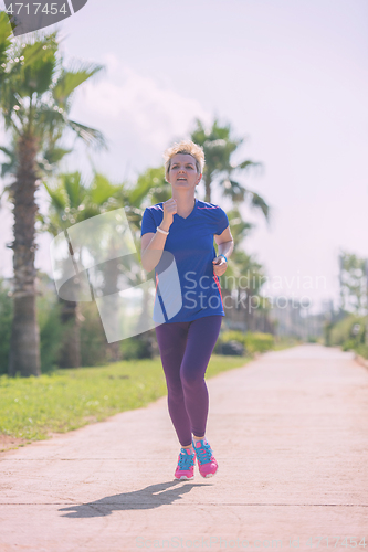 Image of young female runner training for marathon