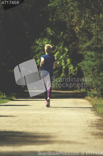 Image of young female runner training for marathon
