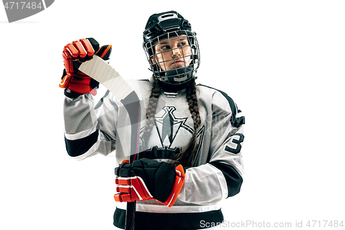 Image of Young female hockey player with the stick isolated on white background