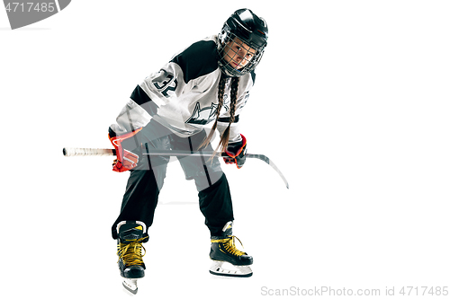Image of Young female hockey player with the stick isolated on white background
