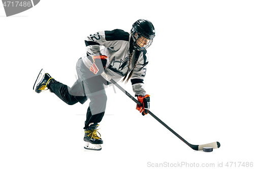 Image of Young female hockey player with the stick isolated on white background