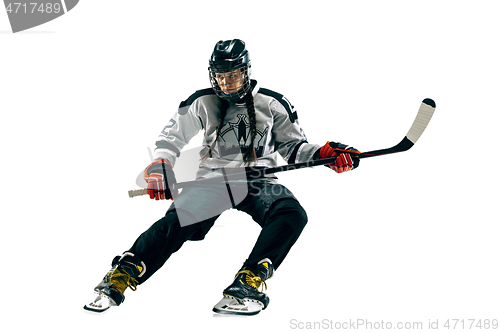 Image of Young female hockey player with the stick isolated on white background