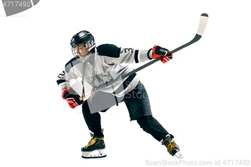 Image of Young female hockey player with the stick isolated on white background