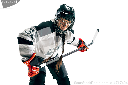 Image of Young female hockey player with the stick isolated on white background