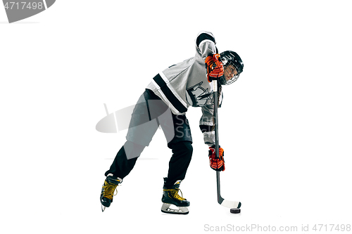 Image of Young female hockey player with the stick isolated on white background