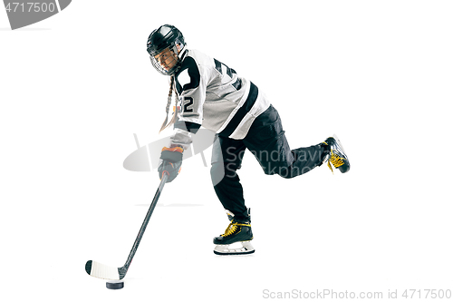 Image of Young female hockey player with the stick isolated on white background