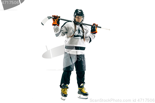 Image of Young female hockey player with the stick isolated on white background