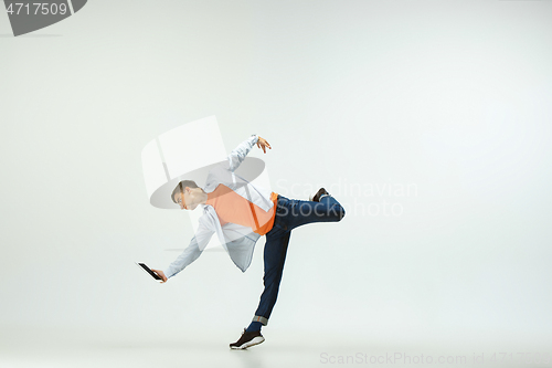 Image of Man working at office and jumping isolated on studio background