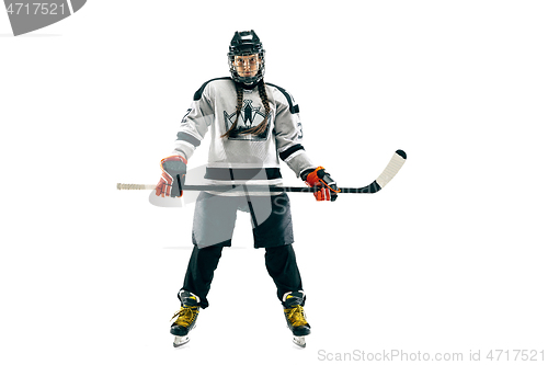 Image of Young female hockey player with the stick isolated on white background