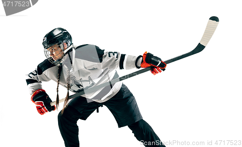 Image of Young female hockey player with the stick isolated on white background