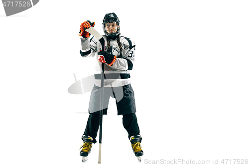 Image of Young female hockey player with the stick isolated on white background