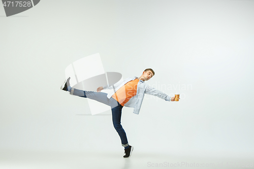 Image of Man working at office and jumping isolated on studio background