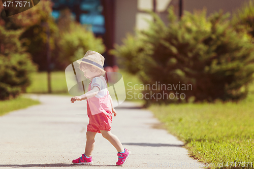 Image of little girl runing in the summer Park