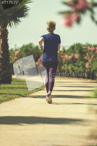 Image of young female runner training for marathon