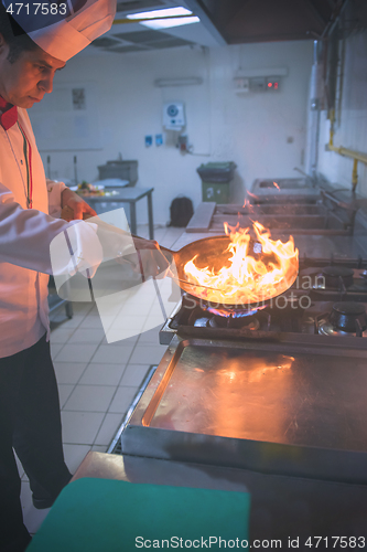 Image of Chef doing flambe on food