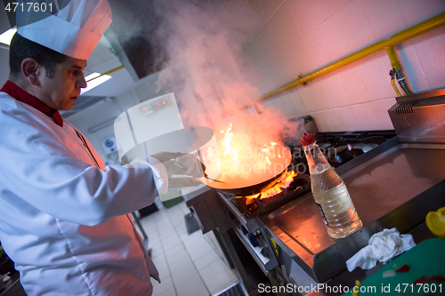 Image of Chef doing flambe on food