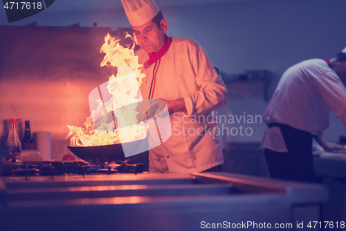 Image of Chef doing flambe on food