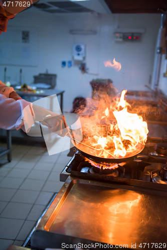 Image of Chef doing flambe on food