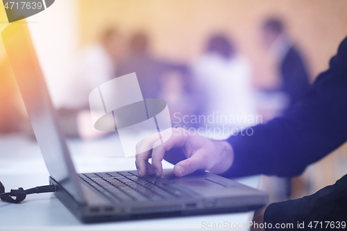 Image of business people hands using laptop computer